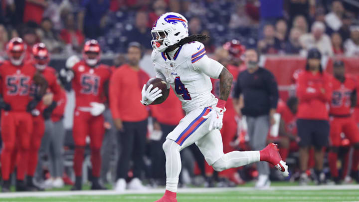 Nov 20, 2025; Houston, Texas, USA; Buffalo Bills running back James Cook III (4) runs for a touchdown against the Houston Texans in the first quarter at NRG Stadium. Mandatory Credit: Troy Taormina-Imagn Images