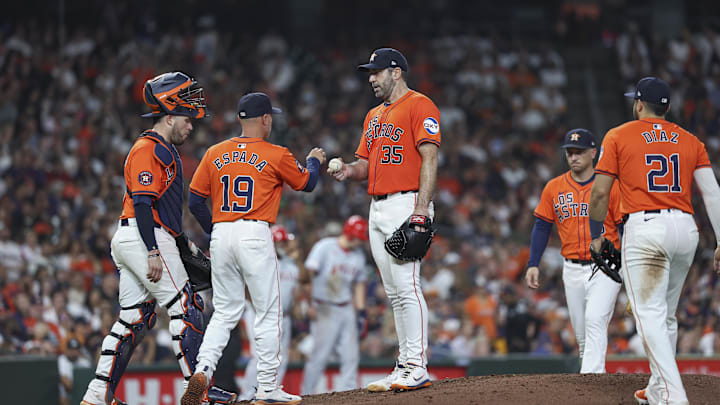 Sep 20, 2024; Houston, Texas, USA; Houston Astros starting pitcher Justin Verlander (35) hands the ball to manager Joe Espada (19) during a pitching change in the fifth inning against the Los Angeles Angels at Minute Maid Park.