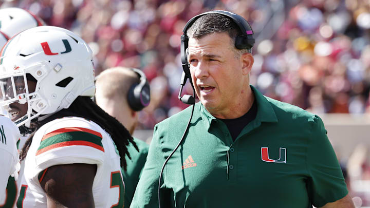 Oct 15, 2022; Blacksburg, Virginia, USA;  Miami Hurricanes head coach Mario Cristobal walks on the sidelines during the second quarter against the Virginia Tech Hokies at Lane Stadium. Mandatory Credit: Reinhold Matay-Imagn Images