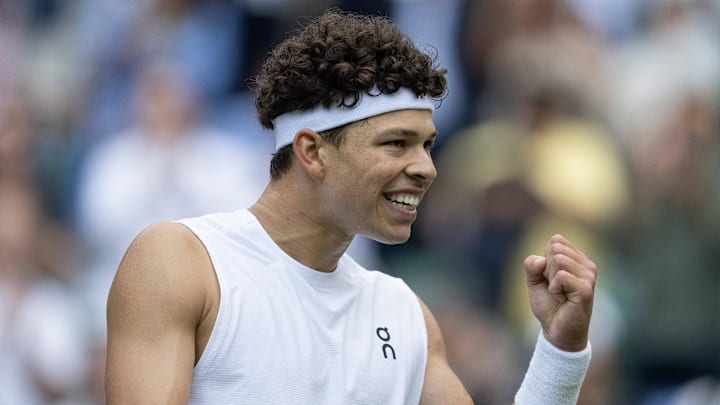 Ben Shelton celebrates winning a Wimbledon match.