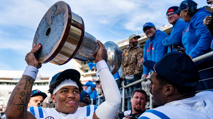 Ole Miss quarterback Trinidad Chambliss (6) raises the Golden Egg trophy after a college football game between Mississippi State and Ole Miss at Davis Wade Stadium in Starkville, Miss., on Friday, Nov. 28, 2025. Ole Miss defeated Mississippi State 38-19 in the Egg Bowl. Ole Miss quarterback Trinidad Chambliss (6) raises the Golden Egg trophy after a college football game between Mississippi State and Ole Miss at Davis Wade Stadium in Starkville, Miss., on Friday, Nov. 28, 2025. Ole Miss defeated Mississippi State 38-19 in the Egg Bowl.