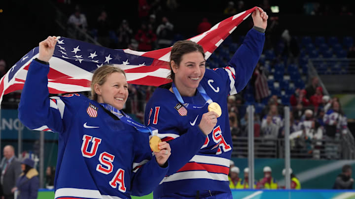 Feb 19, 2026; Milan, Italy; Kendall Coyne (26) of the United States and Hilary Knight (21) of the United States celebrate after winning the gold medal in women's ice hockey after defeating Canada during the Milano Cortina 2026 Olympic Winter Games at Milano Santagiulia Ice Hockey Arena. Mandatory Credit: Amber Searls-Imagn Images Feb 19, 2026; Milan, Italy; Kendall Coyne (26) of the United States and Hilary Knight (21) of the United States celebrate after winning the gold medal in women's ice hockey after defeating Canada during the Milano Cortina 2026 Olympic Winter Games at Milano Santagiulia Ice Hockey Arena. Mandatory Credit: Amber Searls-Imagn Images