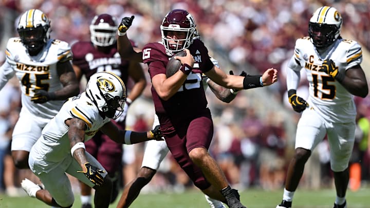 Oct 5, 2024; College Station, Texas, USA; Texas A&M Aggies quarterback Conner Weigman (15) runs the ball in the first half against the Missouri Tigers at Kyle Field. Mandatory Credit: Maria Lysaker-Imagn Images. 