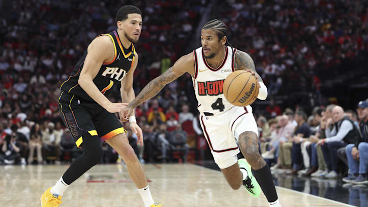 Mar 12, 2025; Houston, Texas, USA; Houston Rockets guard Jalen Green (4) dribbles the ball as Phoenix Suns guard Devin Booker (1) defends during the third quarter at Toyota Center. Mandatory Credit: Troy Taormina-Imagn Images Mar 12, 2025; Houston, Texas, USA; Houston Rockets guard Jalen Green (4) dribbles the ball as Phoenix Suns guard Devin Booker (1) defends during the third quarter at Toyota Center. Mandatory Credit: Troy Taormina-Imagn Images