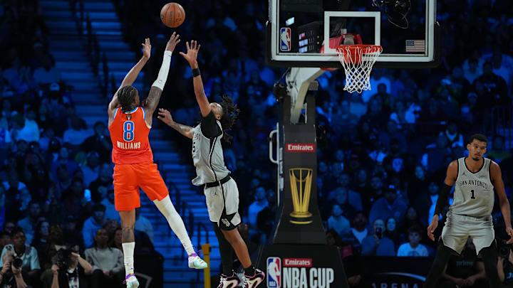 Dec 13, 2025; Las Vegas, Nevada, USA; Oklahoma City Thunder guard Jalen Williams (8) shoots over San Antonio Spurs guard Stephon Castle (5) during the fourth quarter at T-Mobile Arena. Mandatory Credit: Kirby Lee-Imagn Images