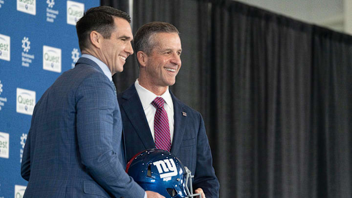 General Manager Joe Schoen and new Giants head coach John Harbaugh hold a NY Giants helmet during a press conference welcoming Harbaugh at the Quest Diagnostics Training Center in East Rutherford on Tuesday, Jan. 20, 2025.