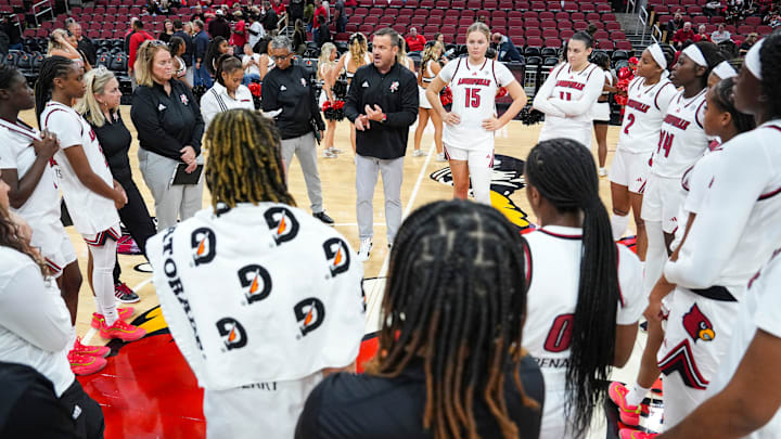 Louisville Cardinals head coach Jeff Walz talks to the Cards after their win over Southern Indiana University Friday night at the KFC Yum! Center in Louisville, Ky. Nov. 8, 2024. Louisville Cardinals head coach Jeff Walz talks to the Cards after their win over Southern Indiana University Friday night at the KFC Yum! Center in Louisville, Ky. Nov. 8, 2024.