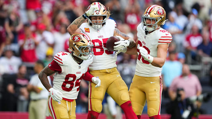 Nov 16, 2025; Glendale, Arizona, USA; San Francisco 49ers tight end George Kittle (85) celebrates scoring a touchdown with tight end Jake Tonges (88) and wide receiver Kendrick Bourne (84) in the first quarter against the Arizona Cardinals at State Farm Stadium. Mandatory Credit: Joe Camporeale-Imagn Images Nov 16, 2025; Glendale, Arizona, USA; San Francisco 49ers tight end George Kittle (85) celebrates scoring a touchdown with tight end Jake Tonges (88) and wide receiver Kendrick Bourne (84) in the first quarter against the Arizona Cardinals at State Farm Stadium. Mandatory Credit: Joe Camporeale-Imagn Images