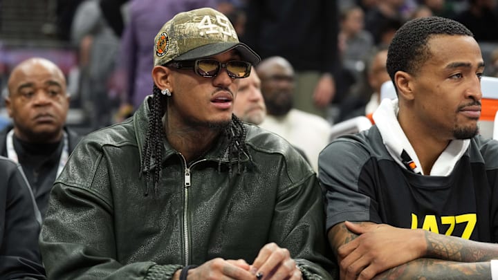 Dec 8, 2024; Sacramento, California, USA; Utah Jazz guard Jordan Clarkson (center) sits on the bench with forward John Collins (right) during the second quarter against the Sacramento Kings at Golden 1 Center. Mandatory Credit: Darren Yamashita-Imagn Images