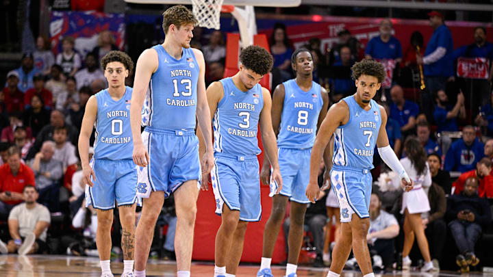 Jan 3, 2026; Dallas, Texas, USA; North Carolina Tar Heels guard Kyan Evans (0) and center Henri Veesaar (13) and guard Derek Dixon (3) and forward Caleb Wilson (8) and 
b7#2 come back on the court during the second half against the SMU Mustangs at Moody Coliseum. Mandatory Credit: Jerome Miron-Imagn Images