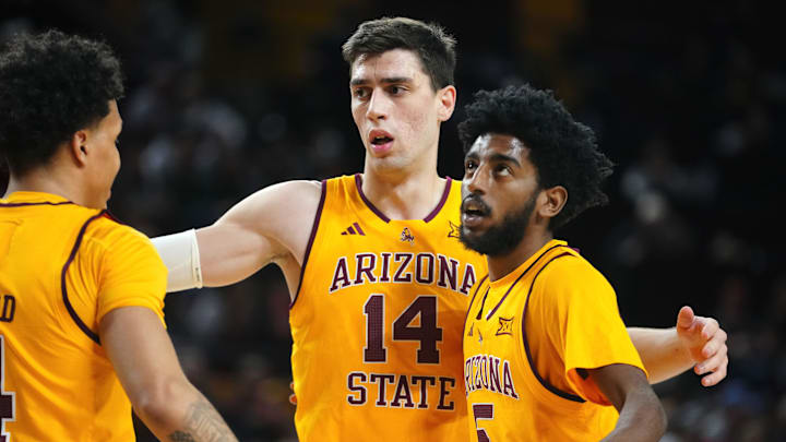 Arizona State forward Andrija Grbović (14) gathers Bryce Ford (4) and Moe Odum (5) during a game against Cincinnati at Desert Financial Arena in Tempe, Ariz., on Jan. 24, 2026.