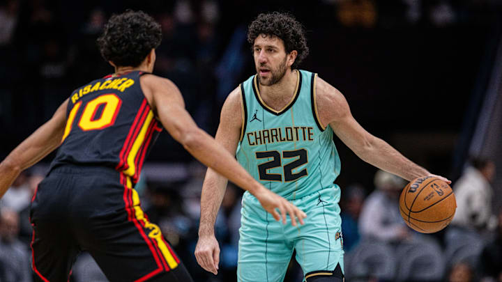 Nov 30, 2024; Charlotte, North Carolina, USA; Charlotte Hornets guard Vasilije Micic (22) brings the ball up court against Atlanta Hawks forward Zaccharie Risacher (10) in the third quarter at Spectrum Center. Mandatory Credit: Scott Kinser-Imagn Images Nov 30, 2024; Charlotte, North Carolina, USA; Charlotte Hornets guard Vasilije Micic (22) brings the ball up court against Atlanta Hawks forward Zaccharie Risacher (10) in the third quarter at Spectrum Center. Mandatory Credit: Scott Kinser-Imagn Images