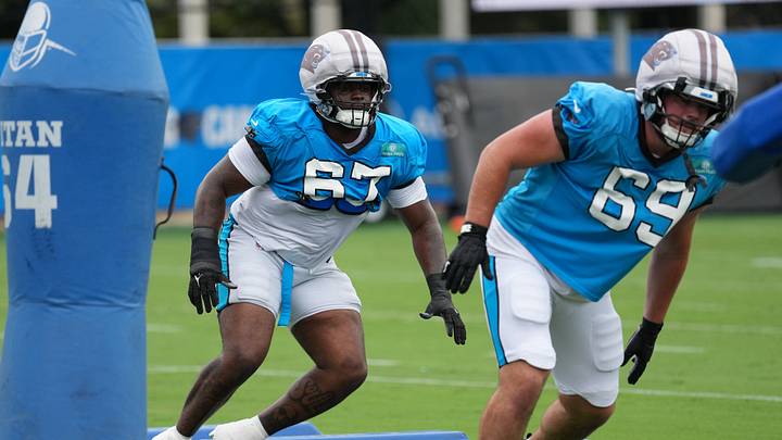 Aug 4, 2026; Charlotte, NC, USA; Carolina Panthers defensive tackle Kyon Barrs (67) and defensive tackle Parker Petersen (69) run a drill during training camp at Bank of America Stadium. Mandatory Credit: Jim Dedmon-Imagn Images