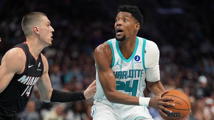 Charlotte Hornets forward Brandon Miller (24) handles the ball against Miami Heat guard Tyler Herro Charlotte Hornets forward Brandon Miller (24) handles the ball against Miami Heat guard Tyler Herro