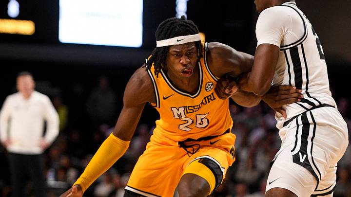 Mar 1, 2025; Nashville, Tennessee, USA; Missouri Tigers guard Mark Mitchell (25) dribbles past Vanderbilt Commodores forward JaQualon Roberts (24) during the second half at Memorial Gymnasium. Mandatory Credit: Steve Roberts-Imagn Images Mar 1, 2025; Nashville, Tennessee, USA; Missouri Tigers guard Mark Mitchell (25) dribbles past Vanderbilt Commodores forward JaQualon Roberts (24) during the second half at Memorial Gymnasium. Mandatory Credit: Steve Roberts-Imagn Images