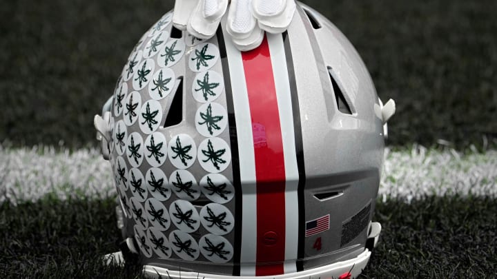 Oct. 14, 2023; Lafayette, In., USA; 
Gloves lie on top of the helmet of Ohio State Buckeyes wide receiver Julian Fleming (4) before Saturday's NCAA Division I football game against the Purdue Boilermakers at Ross-Ade Stadium in Lafayette.
