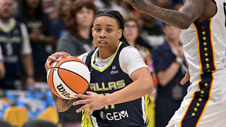 Aug 1, 2025; Dallas, Texas, USA; Dallas Wings guard JJ Quinerly (11) in action during the game between the Dallas Wings and the Indiana Fever at the American Airlines Center. Mandatory Credit: Jerome Miron-Imagn Images