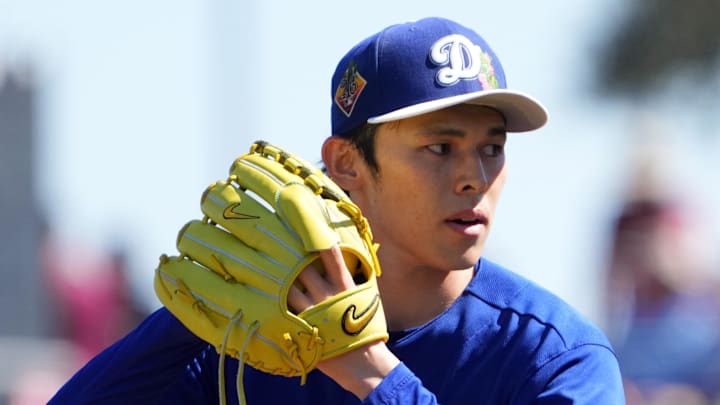 Mar 3, 2026; Goodyear, Arizona, USA; Los Angeles Dodgers starting pitcher Roki Sasaki (11) pitches against the Cleveland Guardians during the first inning at Goodyear Ballpark. Mandatory Credit: Joe Camporeale-Imagn Images