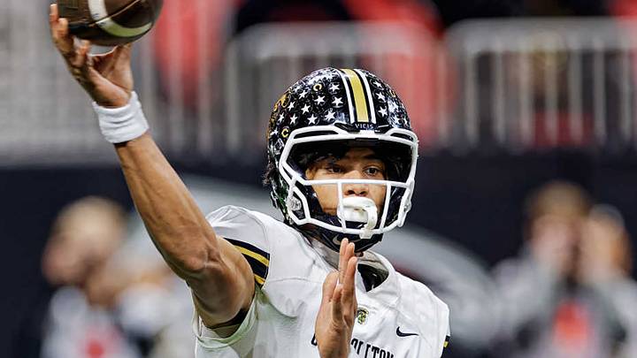 Carrollton's sophomore quarterback CJ Cyphers threw four touchdown passes in the Trojans 55-7 opening night win over Rome. Carrollton's sophomore quarterback CJ Cyphers threw four touchdown passes in the Trojans 55-7 opening night win over Rome.