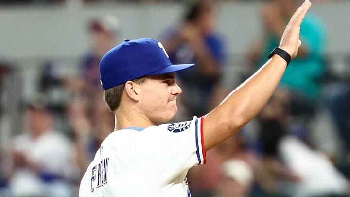 Jul 22, 2025; Arlington, Texas, USA;  Texas Rangers first round draft pick Gavin Fien throws out the ceremonial first pitch before the game against the Athletics at Globe Life Field. Mandatory Credit: Kevin Jairaj-Imagn Images