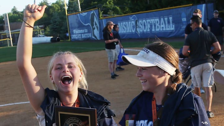 Pine Plains' Eliza Baden (left) and Abbey Mayes celebrate the Section 9 Class C Softball Championship victory over Tri-Valley on May 23, 2024.