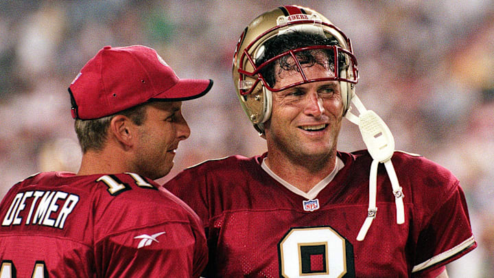 San Francisco 49ers quarterback Steve Young (R) ta