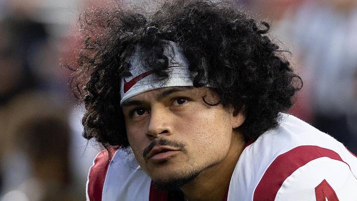 Oct 24, 2026; Madison, Wisconsin, USA; USC Trojans quarterback Jayden Maiava (14) stretches during warmups before the game against the Wisconsin Badgers at Camp Randall Stadium. Mandatory Credit: Anthony Wahl-Imagn Images Oct 24, 2026; Madison, Wisconsin, USA; USC Trojans quarterback Jayden Maiava (14) stretches during warmups before the game against the Wisconsin Badgers at Camp Randall Stadium. Mandatory Credit: Anthony Wahl-Imagn Images