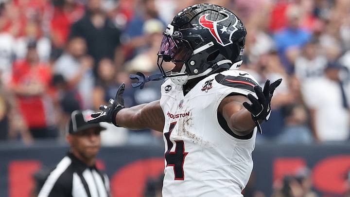 Houston Texans running back Woody Marks (4) reacts after scoring a touchdown during the fourth quarter against the Dallas Cowboys at Reliant Stadium.  Mandatory Credit: Troy Taormina-Imagn Images