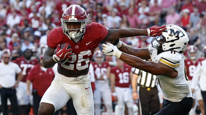 Oct 26, 2024; Tuscaloosa, Alabama, USA; Alabama Crimson Tide running back Jam Miller (26) stiff arms Missouri Tigers linebacker Corey Flagg Jr. (11) as he carries the ball in for a touchdown during the second half at Bryant-Denny Stadium. Mandatory Credit: Butch Dill-Imagn Images Oct 26, 2024; Tuscaloosa, Alabama, USA; Alabama Crimson Tide running back Jam Miller (26) stiff arms Missouri Tigers linebacker Corey Flagg Jr. (11) as he carries the ball in for a touchdown during the second half at Bryant-Denny Stadium. Mandatory Credit: Butch Dill-Imagn Images