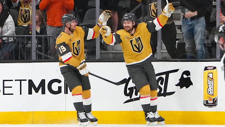 Mar 30, 2026; Las Vegas, Nevada, USA; Vegas Golden Knights defenseman Rasmus Andersson (4) celebrates with right wing Reilly Smith (19) after scoring a goal against the Vancouver Canucks during the second period at T-Mobile Arena. Mandatory Credit: Stephen R. Sylvanie-Imagn Images Mar 30, 2026; Las Vegas, Nevada, USA; Vegas Golden Knights defenseman Rasmus Andersson (4) celebrates with right wing Reilly Smith (19) after scoring a goal against the Vancouver Canucks during the second period at T-Mobile Arena. Mandatory Credit: Stephen R. Sylvanie-Imagn Images