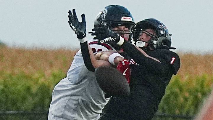 Gilbert wide receiver/defensive back Charlie Reich 91) knocks out the ball from Mason City wide receiver Aden Kraft (12) during the second quarter in the week-2 Iowa high school football at Tiger Stadium on Sept. 4, 2026, in Gilbert, Iowa. Gilbert wide receiver/defensive back Charlie Reich 91) knocks out the ball from Mason City wide receiver Aden Kraft (12) during the second quarter in the week-2 Iowa high school football at Tiger Stadium on Sept. 4, 2026, in Gilbert, Iowa.