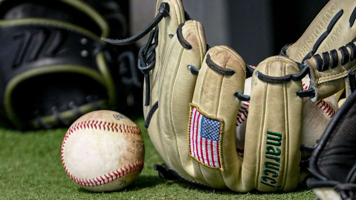 Baseball and US flag patch on a baseball glove before the top of the sixth inning at Doug Kingsmore Stadium in Clemson, S.C. Saturday, Feb 14, 2026. Baseball and US flag patch on a baseball glove before the top of the sixth inning at Doug Kingsmore Stadium in Clemson, S.C. Saturday, Feb 14, 2026.