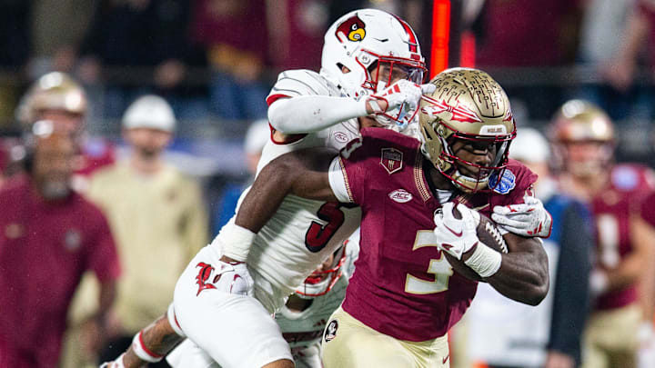 Florida State Seminoles running back Trey Benson (3) makes his way down the field. The Florida State