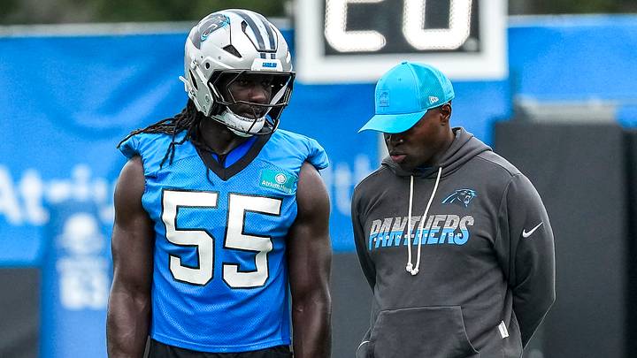 Carolina Panthers linebacker Devin Lloyd (55) chats with defensive coordinator Ejiro Evero Carolina Panthers linebacker Devin Lloyd (55) chats with defensive coordinator Ejiro Evero