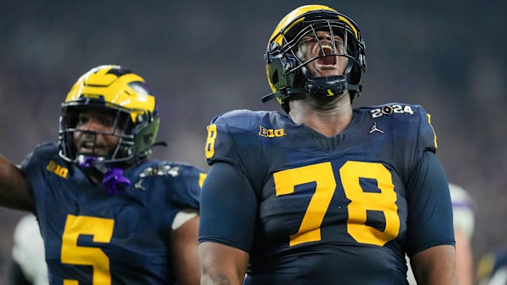 Michigan defensive lineman Kenneth Grant celebrates a sack on Washington quarterback Michael Penix Jr. during the College Football Playoff national championship game against Washington at NRG Stadium in Houston, Texas, on Monday, Jan. 8, 2024. Michigan defensive lineman Kenneth Grant celebrates a sack on Washington quarterback Michael Penix Jr. during the College Football Playoff national championship game against Washington at NRG Stadium in Houston, Texas, on Monday, Jan. 8, 2024.