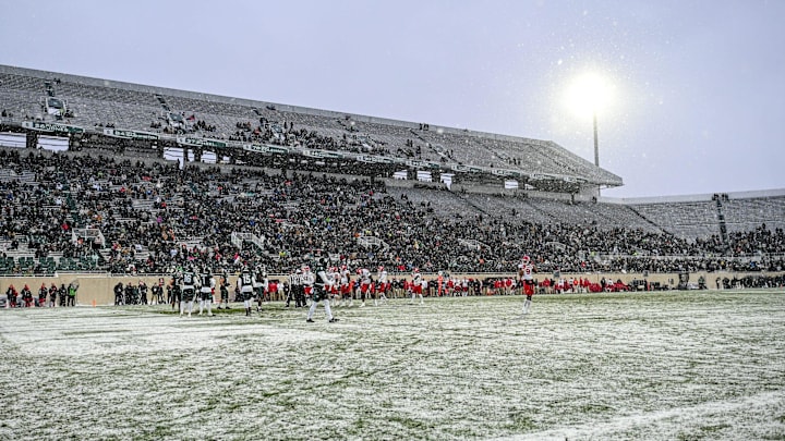 Snow falls during Michigan State's game against Rutgers in the first quarter on Saturday, Nov. 30, 2024, at Spartan Stadium in East Lansing.