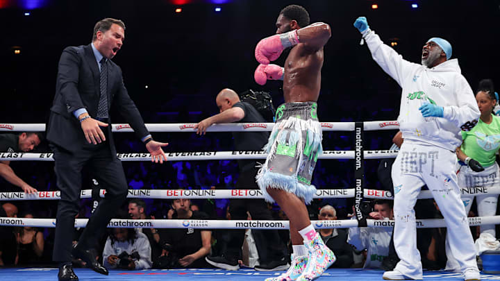 Eddie Hearn, Jaron Ennis and Bozy Ennis after Eimantas Stanionis' corner stopped the fight.