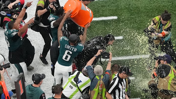 Philadelphia Eagles head coach Nick Sirianni is dunked with Gatorade by wide receivers DeVonta Smith and A.J. Brown in the fourth quarter against the Kansas City Chiefs during Super Bowl LIX.