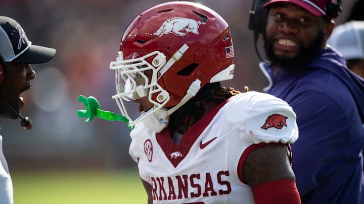 Arkansas Razorbacks defensive back TJ Metcalf (18) celebrates his forced fumble as Auburn Tigers take on Arkansas Razorbacks at Jordan-Hare Stadium in Auburn, Ala., on Saturday, Sept. 21, 2024. Arkansas Razorbacks lead Auburn Tigers 7-0 at halftime.