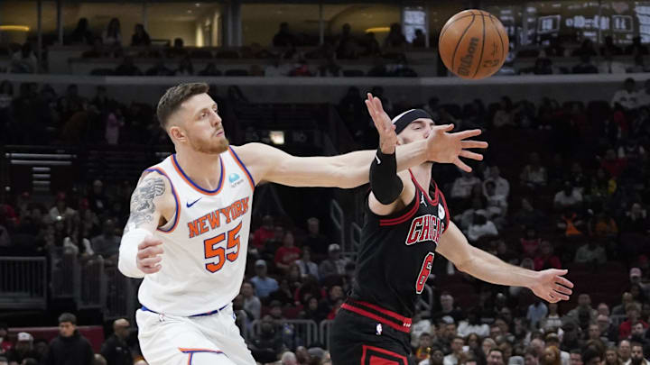 Apr 5, 2024; Chicago, Illinois, USA; Chicago Bulls guard Alex Caruso (6) and New York Knicks center Isaiah Hartenstein (55) go for the ball during the second half at United Center Apr 5, 2024; Chicago, Illinois, USA; Chicago Bulls guard Alex Caruso (6) and New York Knicks center Isaiah Hartenstein (55) go for the ball during the second half at United Center
