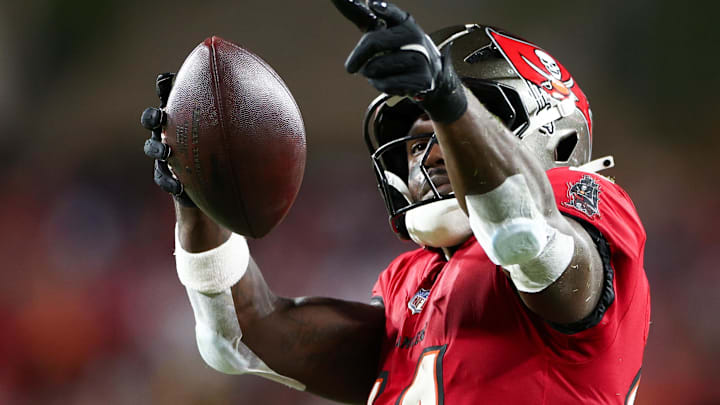 Oct 21, 2024; Tampa, Florida, USA; Tampa Bay Buccaneers wide receiver Chris Godwin (14) celebrates a first down against the Baltimore Ravens in the second quarter at Raymond James Stadium. Mandatory Credit: Nathan Ray Seebeck-Imagn Images