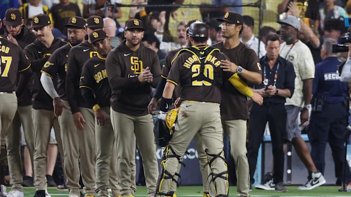 Oct 6, 2024; Los Angeles, California, USA; San Diego Padres catcher Kyle Higashioka (20) and pitcher Yu Darvish (11) celebrate after defeating the Los Angeles Dodgers in game two of the NLDS for the 2024 MLB Playoffs at Dodger Stadium. Mandatory Credit: Kiyoshi Mio-Imagn Images Oct 6, 2024; Los Angeles, California, USA; San Diego Padres catcher Kyle Higashioka (20) and pitcher Yu Darvish (11) celebrate after defeating the Los Angeles Dodgers in game two of the NLDS for the 2024 MLB Playoffs at Dodger Stadium. Mandatory Credit: Kiyoshi Mio-Imagn Images