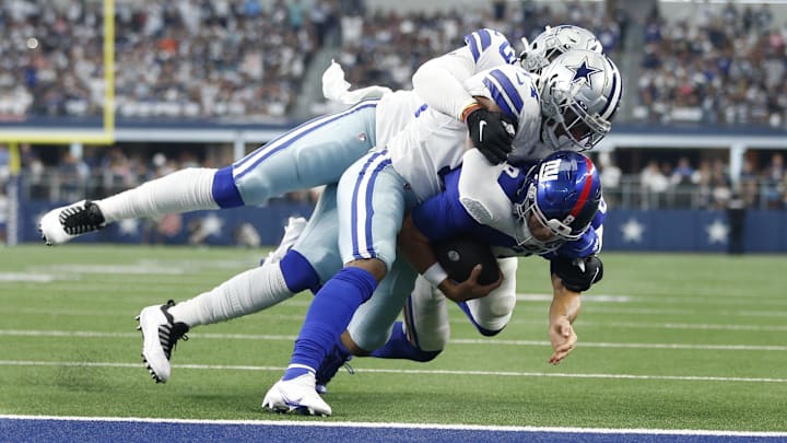 Oct 10, 2021; Arlington, Texas, USA; New York Giants quarterback Daniel Jones (8) is tackled by
