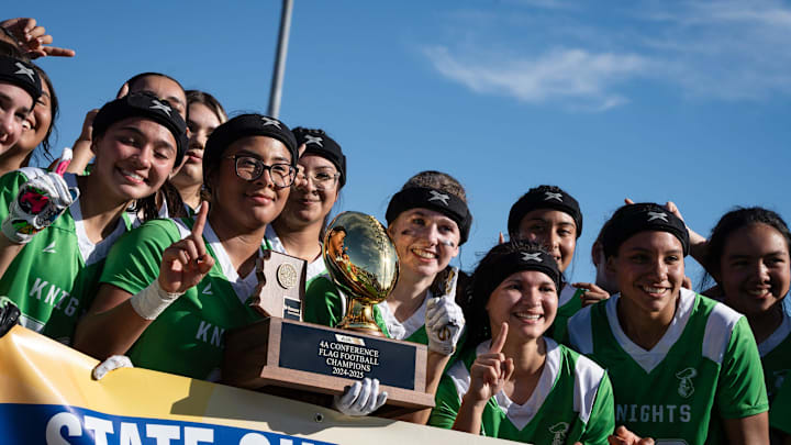 The St. Mary’s Knights receive their trophy and banner after winning the 4A Girls Flag Football Championship game against Prescott High School at Chandler High School on Nov. 23, 2024, in Chandler. The St. Mary’s Knights receive their trophy and banner after winning the 4A Girls Flag Football Championship game against Prescott High School at Chandler High School on Nov. 23, 2024, in Chandler.