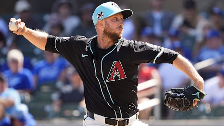 Arizona Diamondbacks starting pitcher Merrill Kelly throws to the Kansas City Royals in the third inning during a spring training game at Salt River Fields at Talking Stick on March 11, 2025.
