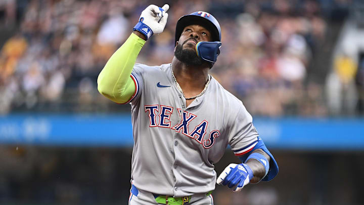 Jun 11, 2025; Pittsburgh, Pennsylvania, USA; Texas Rangers right fielder Adolis Garcia Celebrates after hitting a solo home run against the Pittsburgh Pirates during the fourth inning at PNC Park