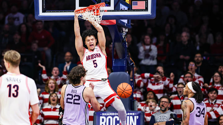 Jan 7, 2026; Tucson, Arizona, USA; Arizona Wildcats guard Brayden Burries (5) dunks the ball over Kansas State Wildcats center Dorin Buca (22) during the first half of the game at McKale Memorial Center. Mandatory Credit: Aryanna Frank-Imagn Images Jan 7, 2026; Tucson, Arizona, USA; Arizona Wildcats guard Brayden Burries (5) dunks the ball over Kansas State Wildcats center Dorin Buca (22) during the first half of the game at McKale Memorial Center. Mandatory Credit: Aryanna Frank-Imagn Images