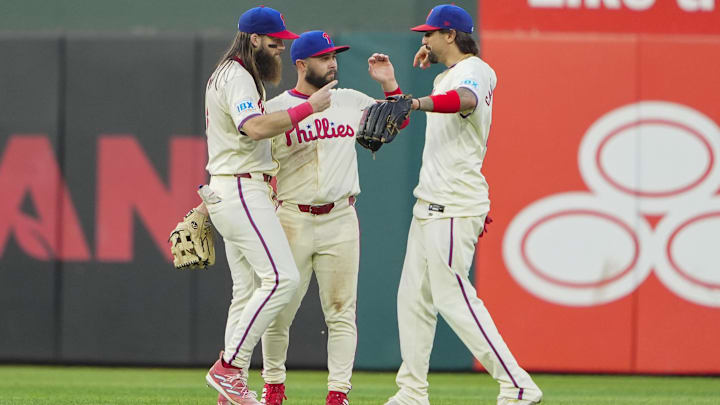 Sep 14, 2024; Philadelphia, Pennsylvania, USA; Philadelphia Phillies left fielder Brandon Marsh (16) and center fielder Cal Stevenson (47) and right fielder Nick Castellanos (8) celebrate after defeating the New York Mets at Citizens Bank Park. Sep 14, 2024; Philadelphia, Pennsylvania, USA; Philadelphia Phillies left fielder Brandon Marsh (16) and center fielder Cal Stevenson (47) and right fielder Nick Castellanos (8) celebrate after defeating the New York Mets at Citizens Bank Park.