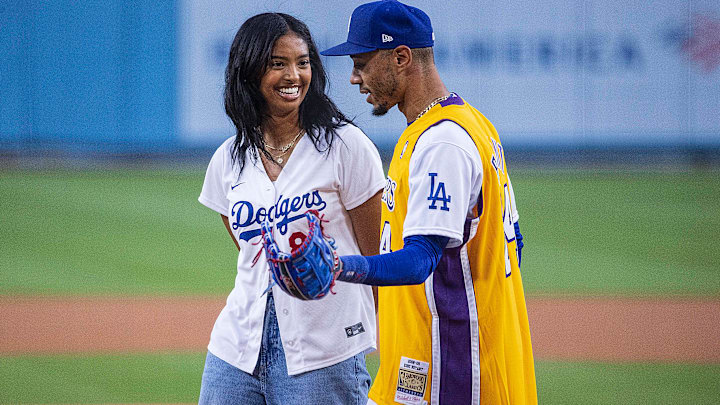 Natalia Bryant speaks to Mookie Betts after throwing the ceremonial first pitch prior to the regular season MLB game between the Los Angeles Dodgers and the Atlanta Braves.