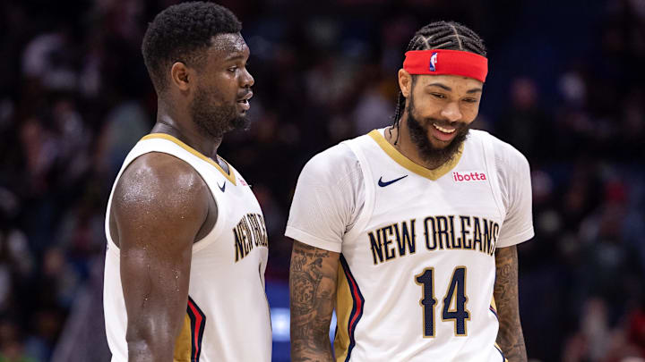 Dec 31, 2023; New Orleans, Louisiana, USA;  New Orleans Pelicans forward Zion Williamson (1) and forward Brandon Ingram (14) share a laugh after a play against the Los Angeles Lakers during the second half at Smoothie King Center. Mandatory Credit: Stephen Lew-Imagn Images